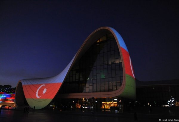 Heydar Aliyev Center in Baku illuminated with colors of National Flag of Azerbaijan