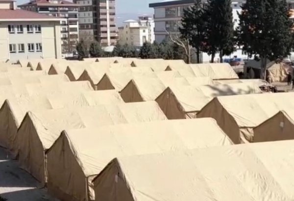 Tent cities vacated as permanent houses rise in quake zone